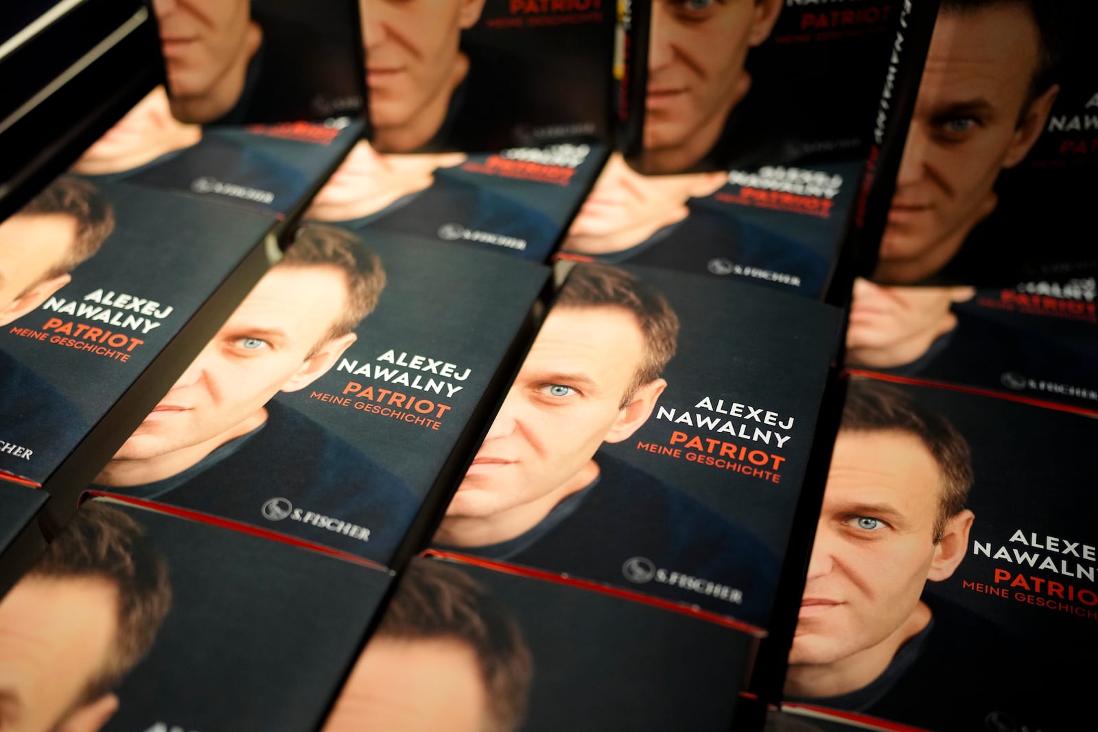 Copies of the late Russian opposition leader Alexei Navalny's memoir entitled 'Patriot' are put display on the first day of sale in a bookshop in Berlin, Germany, Tuesday, Oct. 22, 2024. (AP Photo/Markus Schreiber)