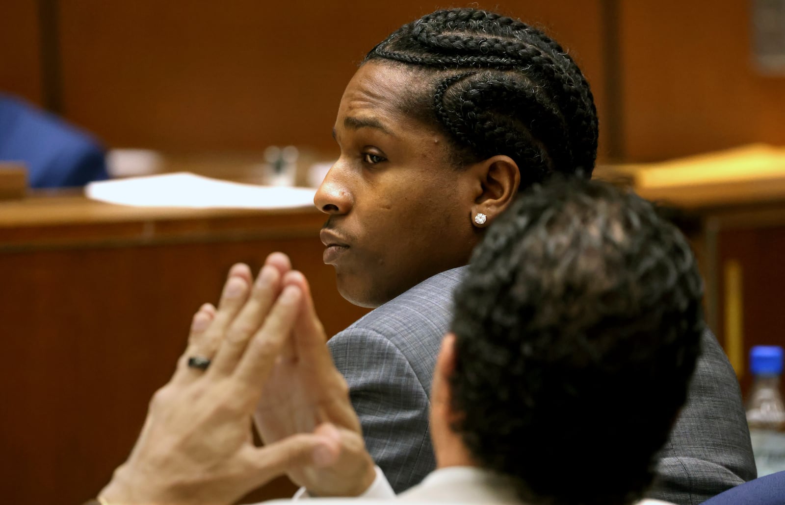 Rakim Mayers, aka A$AP Rocky, and his attorney Joe Tacopina listen to opening remarks by the prosecuting attorney in Mayers' trial at the Clara Shortridge Foltz Criminal Justice Center in downtown Los Angeles, Friday, Jan. 24, 2025. (Genaro Molina/Los Angeles Times via AP, Pool)