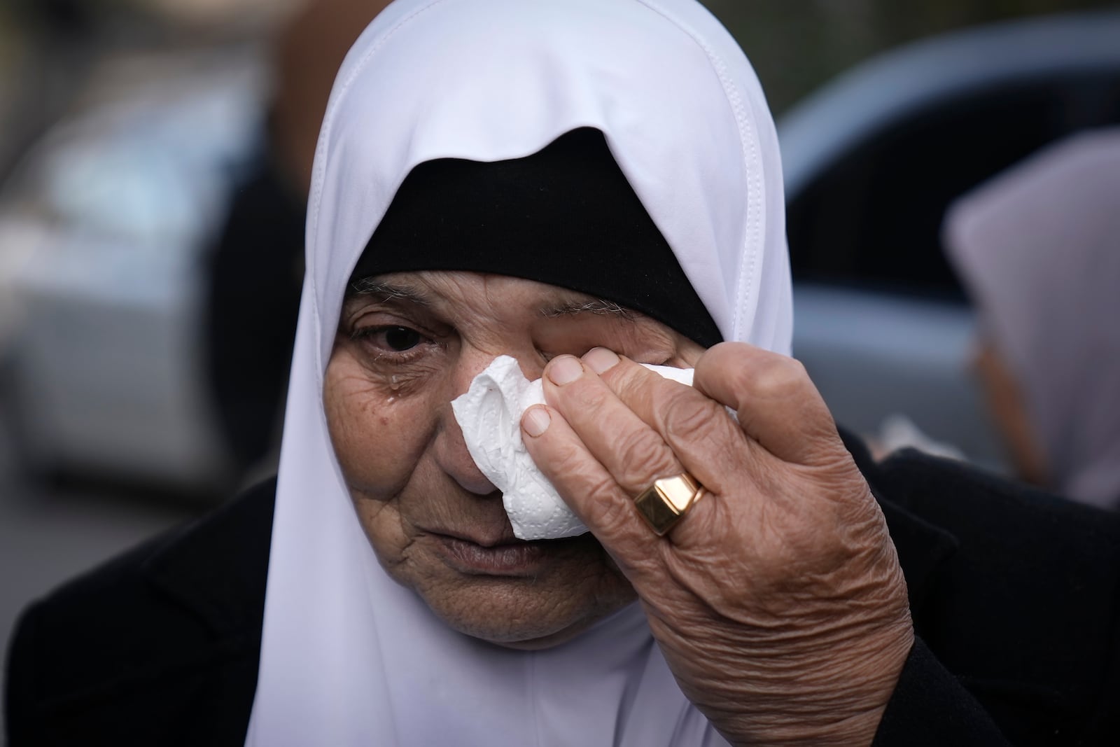 A woman cries as she attends the funeral of Muhammad Hamarsheh, 13, and Ahmad Zaid, 20, killed during an Israeli military raid in the village of Yabad near the West Bank city of Jenin, Monday, Nov. 25, 2024. (AP Photo/Majdi Mohammed)