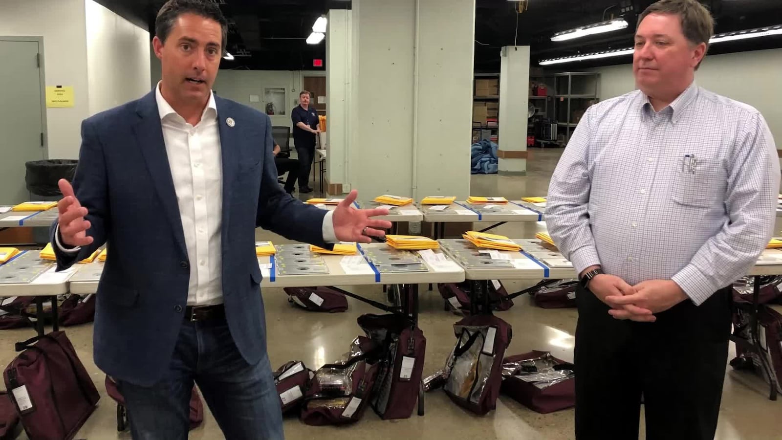 In this file photo from 2022 Ohio Secretary of State Frank LaRose and Jeff Rezabek, director of the Montgomery County Board of Elections, talk about the May 3, 2022 primary.