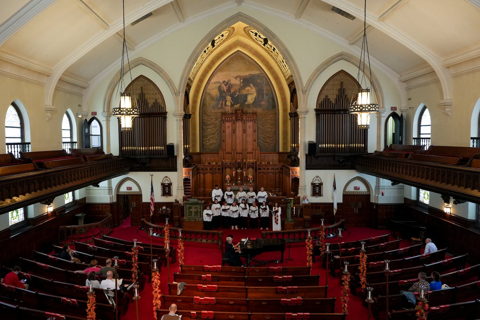 The choir of Grace United Methodist Church sings during a service in Harrisburg, Pa., on Sunday, Oct. 27, 2024. (AP Photo/Luis Andres Henao)