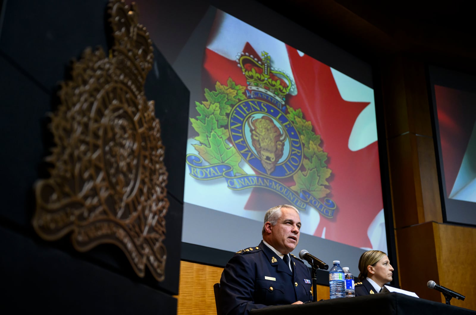 RCMP Commissioner Mike Duheme, left, and Assistant Commissioner Brigitte Gauvin participate in a news conference at RCMP National Headquarters in Ottawa, Ontaio, Monday, Oct. 14, 2024. (Justin Tang/The Canadian Press via AP)