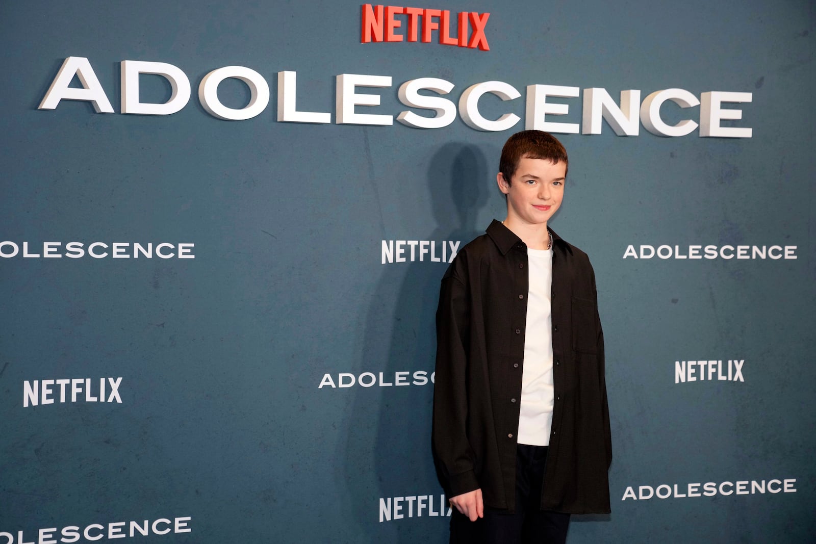 Owen Cooper poses for photographers upon arrival at the special screening for "Adolescence" in London, Wednesday, March 12, 2025. (AP Photo/Kin Cheung)