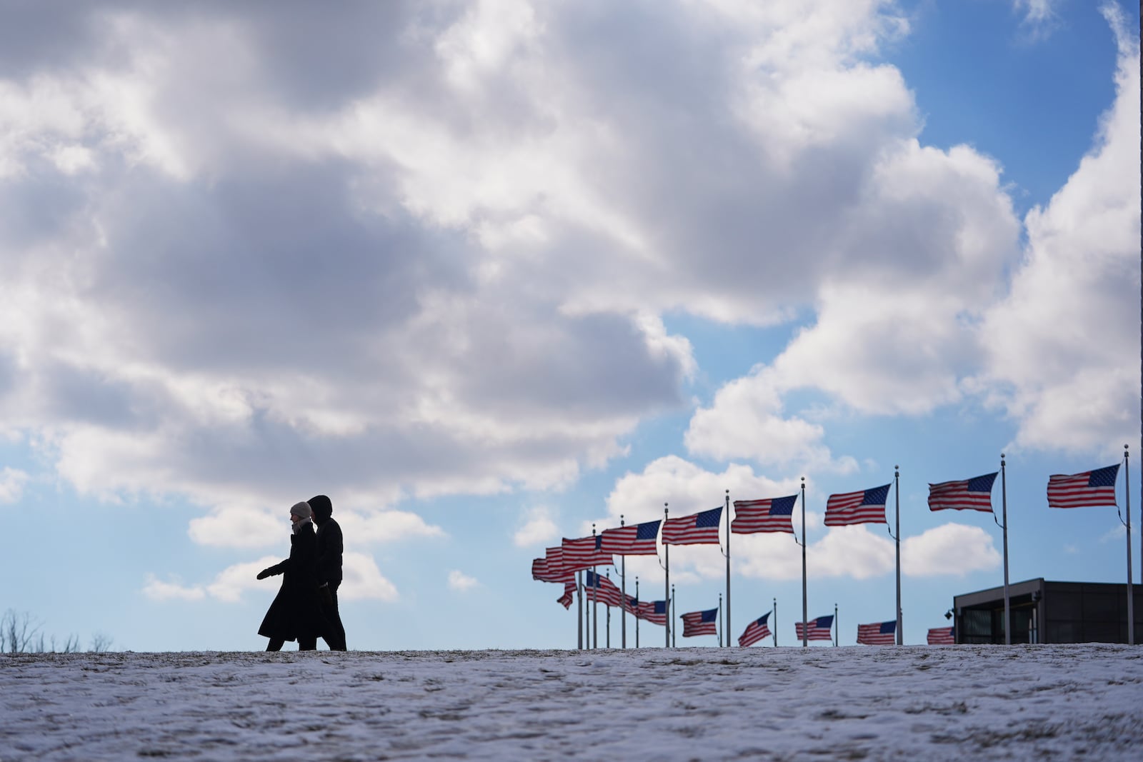 U.S. flags around the Washington Monument are at full staff ahead of the 60th Presidential Inauguration, Monday, Jan. 20, 2025, in Washington. Flags are supposed to fly at half-staff through the end of January out of respect for former President Jimmy Carter, who died Dec. 29, 2024. (AP Photo/Julio Cortez)