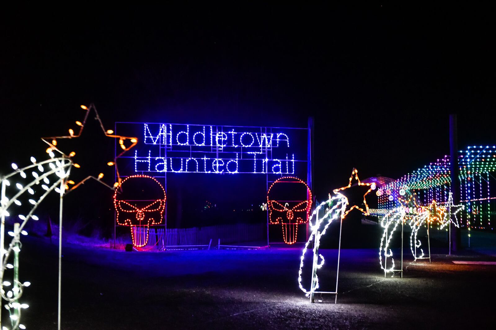 The Land of Illusion Christmas Glow on Thomas Road in Madison Township is open nightly through December with over 3.5 million lights in a 1.5 mile drive-through light display.  Land of Illusion Scream Park is open during the Halloween season featuring Middletown Haunted Trail, Zombie Sniper Patrol and more. NICK GRAHAM/STAFF