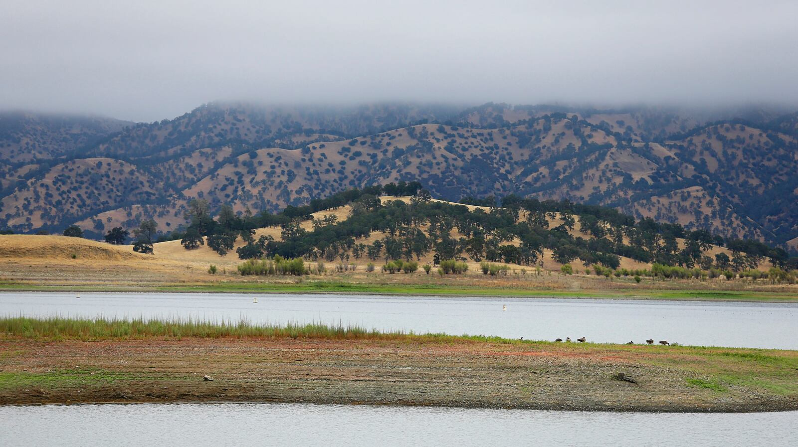 FILE - Lake Berryessa is seen with parts of California's newest national monument in the background, July 10, 2015, near Berryessa Snow Mountain National Monument, Calif. (AP Photo/Eric Risberg, File)