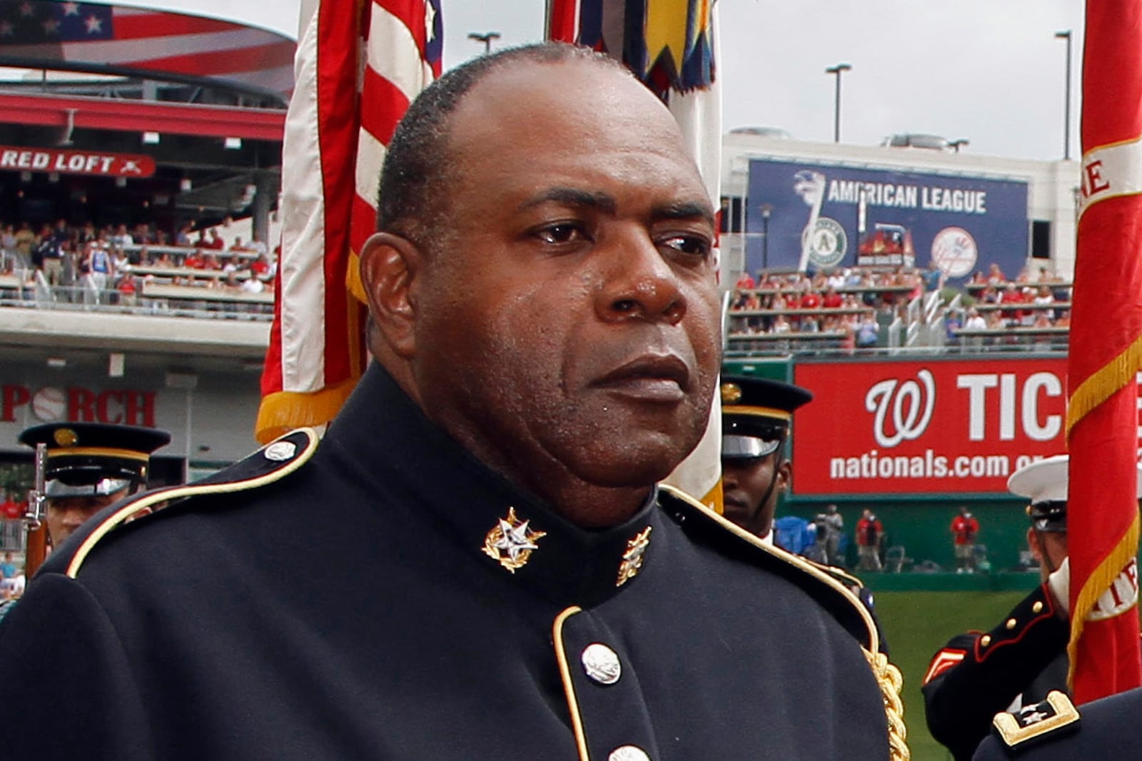 FILE - Sgt. 1st Class Alvy Powell sings the national anthem before a baseball game in Washington, July 4, 2013. (AP Photo/Alex Brandon, File)