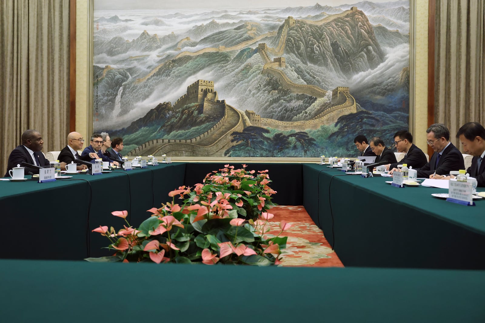 Britain's Foreign Secretary David Lammy, left, attends a meeting with Chinese Vice Premier Ding Xuexiang, second right, at the Great Hall of the People in Beijing Friday, Oct. 18, 2024. (Florence Lo/Pool Photo via AP)