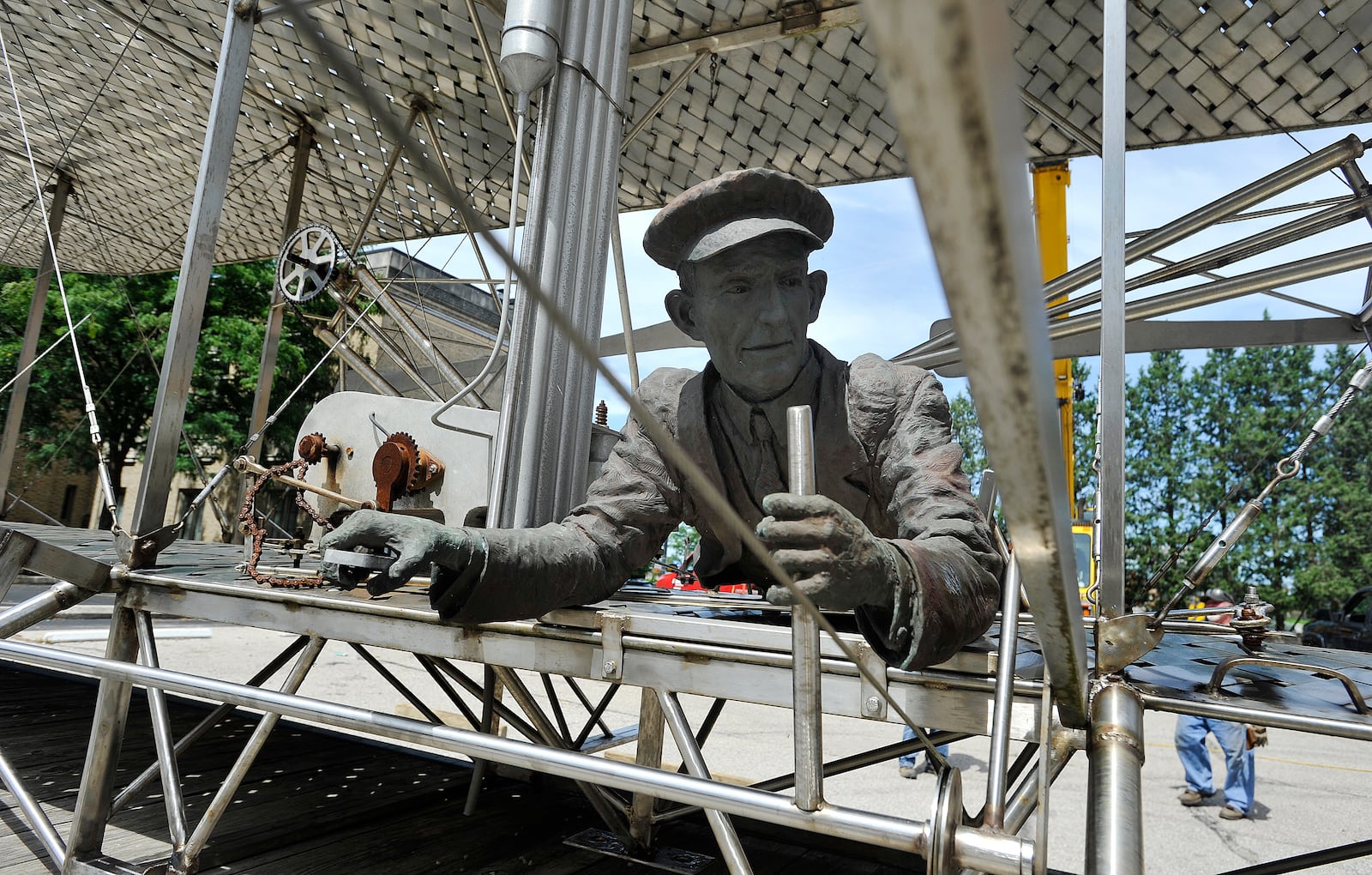 Workers for Schumacher Crane spent Friday moving the Wright Brothers lll sculpture that has been on Monument Avenue across from Riverscape Metro Park for 19 years. The sculpture will be moved to the west end of the Third Street bridge to allow for redevelopment of the Monument Avenue site. MARSHALL GORBY/STAFF