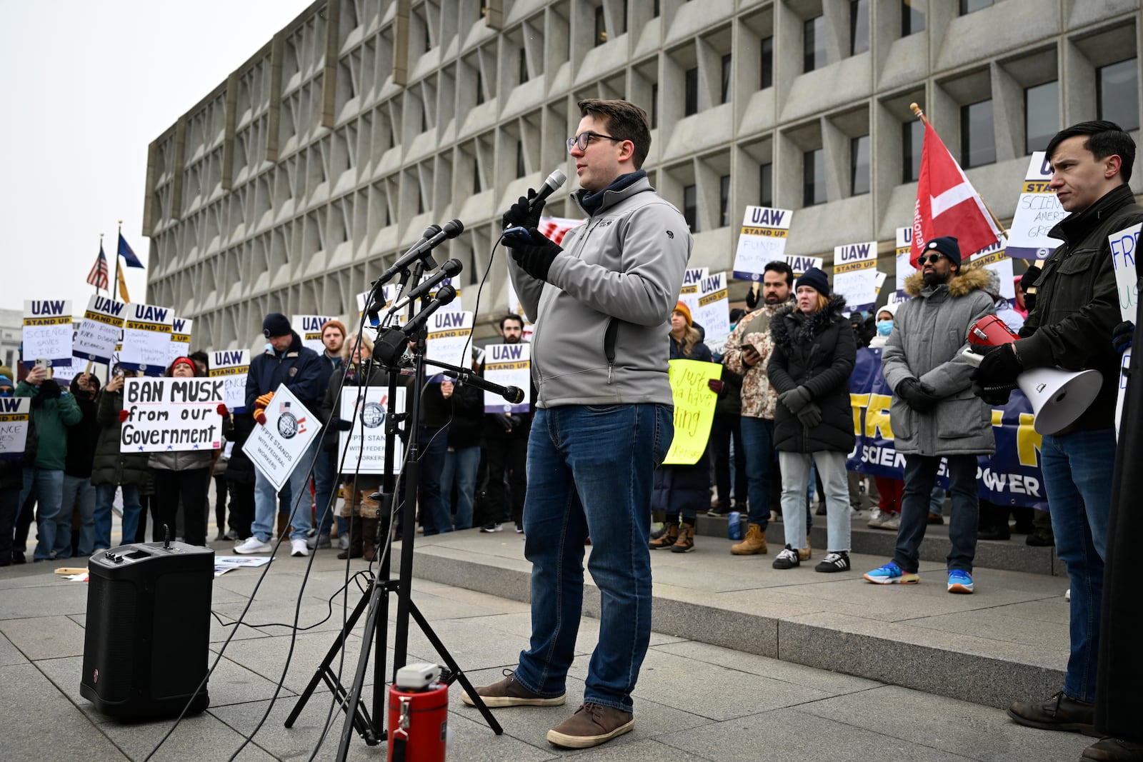 Ian Fucci a research fellow at the National Cancer Institute, speaks at rally at Health and Human Services headquarters to protest the polices of President Donald Trump and Elon Musk Wednesday, Feb. 19, 2025, in Washington. (AP Photo/John McDonnell)