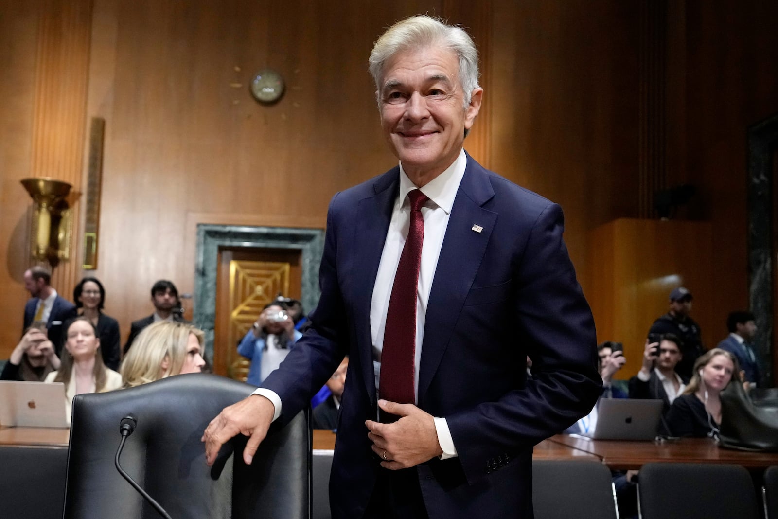 Dr. Mehmet Oz, President Donald Trump's pick to lead the Centers for Medicare and Medicaid Services, arrives to testify at his confirmation hearing before the Senate Finance Committee, on Capitol Hill in Washington, Friday, March 14, 2025. (AP Photo/Ben Curtis)