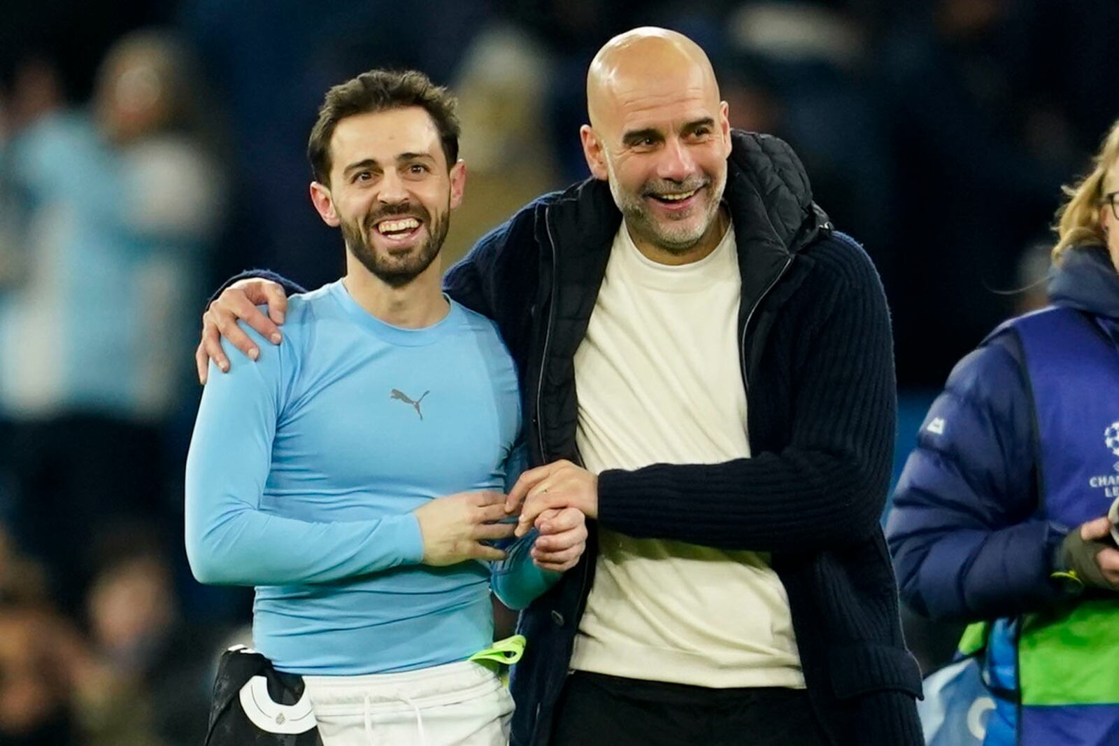 Manchester City's head coach Pep Guardiola celebrates with Bernardo Silva afte the Champions League opening phase soccer match between Manchester City and Club Brugge at the Etihad Stadium in Manchester, Wednesday, Jan. 29, 2025. (AP Photo/Dave Thompson)