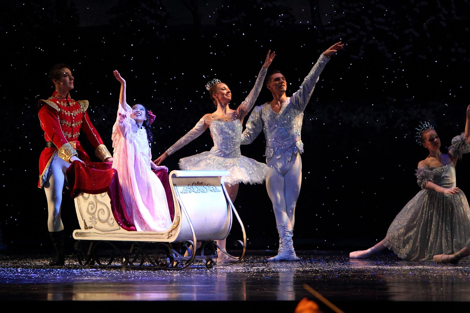 Clara is escorted by her Cavalier and the Snow King and Snow Queen off to the Land of Sweets in Dayton Ballet’s The Nutcracker.