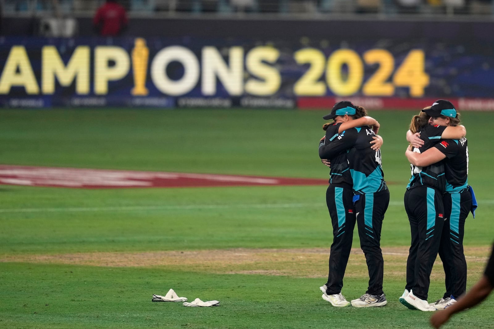 New Zealand's players celebrate after winning the ICC Women's T20 World Cup 2024 final match against South Africa at Dubai, United Arab Emirates, Sunday, Oct. 20, 2024. (AP Photo/Altaf Qadri)