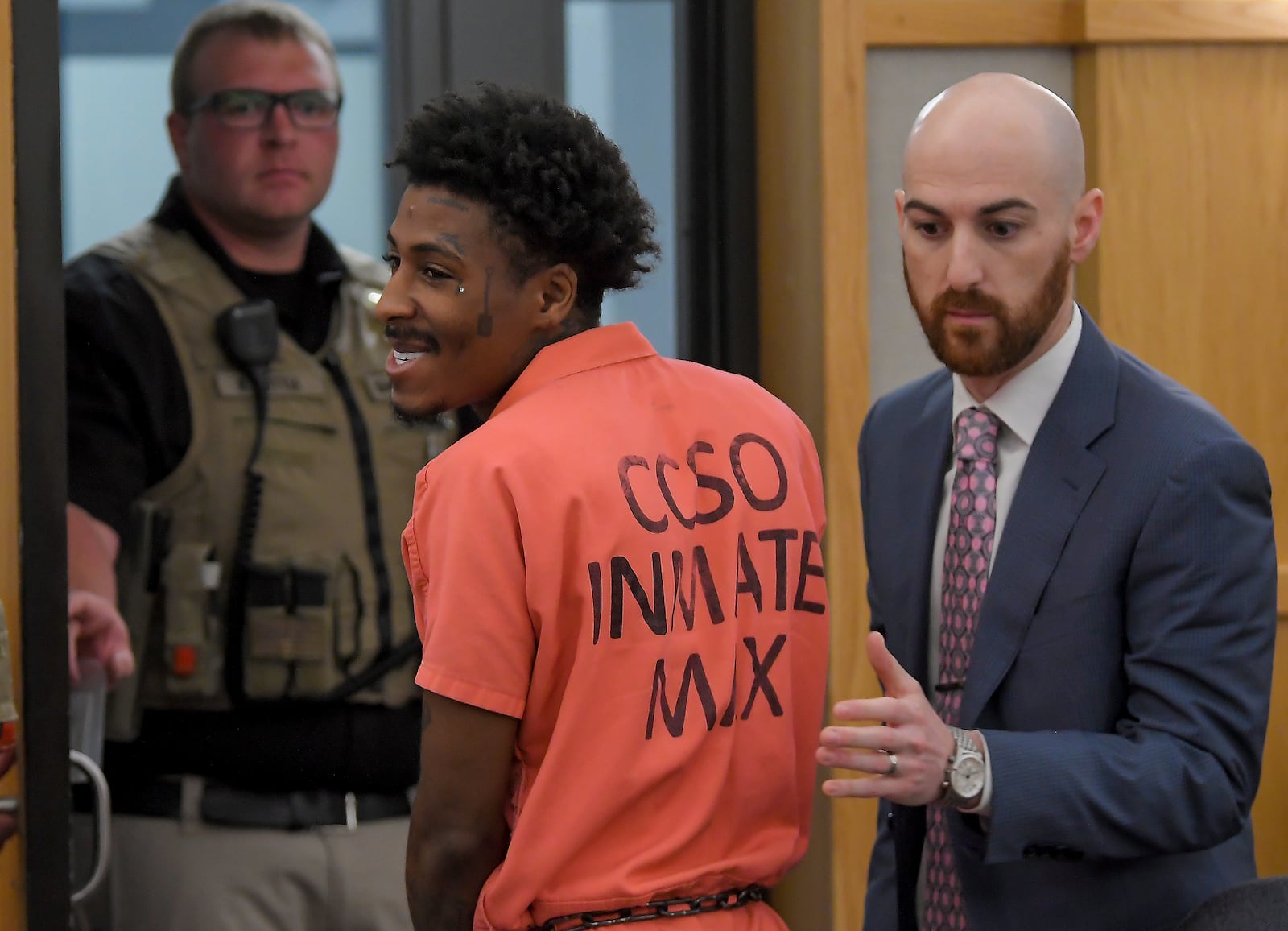 FILE - Kentrell Gaulden, also known as NBA YoungBoy, smiles as he is led out of the courtroom by his defense attorney Zack Findling following a hearing in 1st District Court, Thursday, May 9, 2024, in Logan, Utah. (Eli Lucero/The Herald Journal via AP, File)