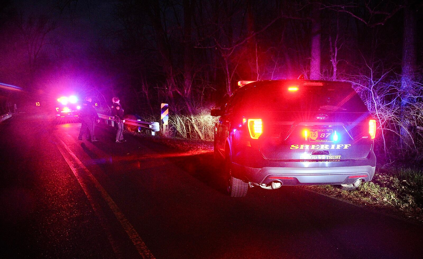 A pursuit that started in Donnelsville in Clark County ended after the car went off Scarff Road near New Carlisle and into a creek in Miami County. One suspect was taken into custody and the second ran from the scene. MARSHALL GORBY/STAFF