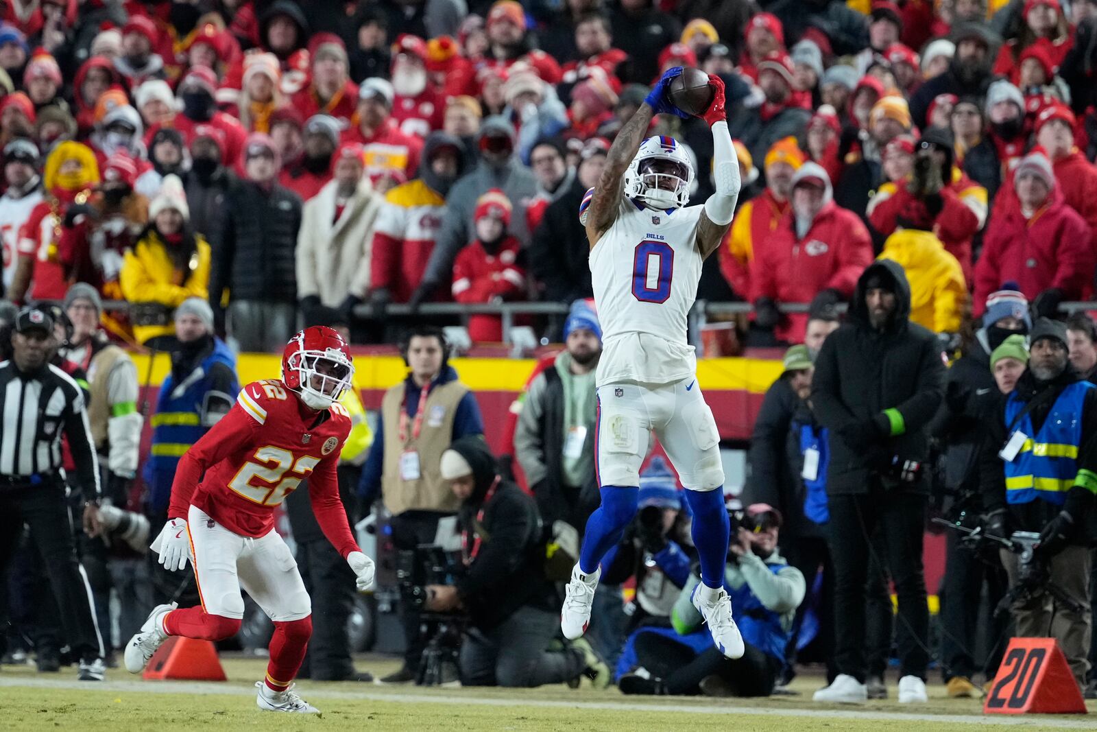 Buffalo Bills wide receiver Keon Coleman (0) catches a pass as Kansas City Chiefs cornerback Trent McDuffie (22) during the first half of the AFC Championship NFL football game, Sunday, Jan. 26, 2025, in Kansas City, Mo. (AP Photo/Ed Zurga)