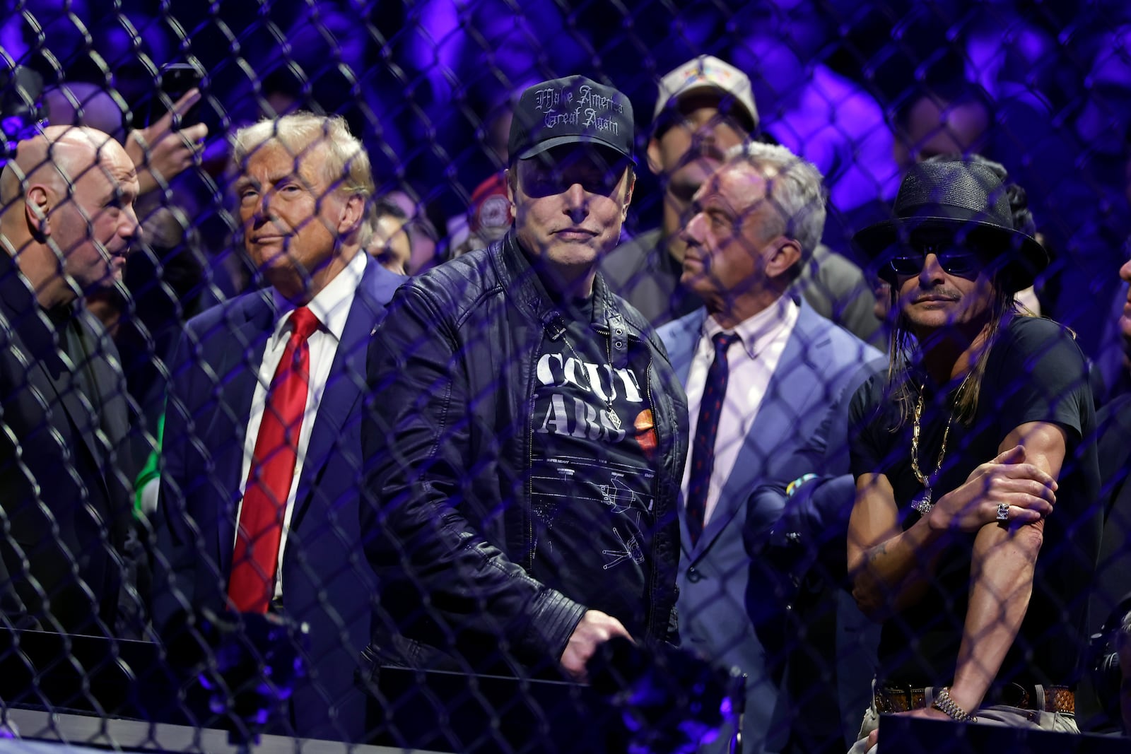 President-elect Donald Trump talks to CEO of UFC Dana White, left, as Elon Musk, second right, looks on at the UFC 309 mixed martial arts event, Saturday, Nov. 16, 2024, in New York. (AP Photo/Adam Hunger)