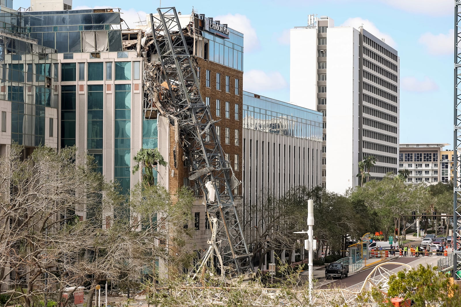 A high rise construction crane broke apart and crashed into the building across the street during Hurricane Milton on Thursday, Oct. 10, 2024, in St. Petersburg, Fla. (AP Photo/Mike Carlson)