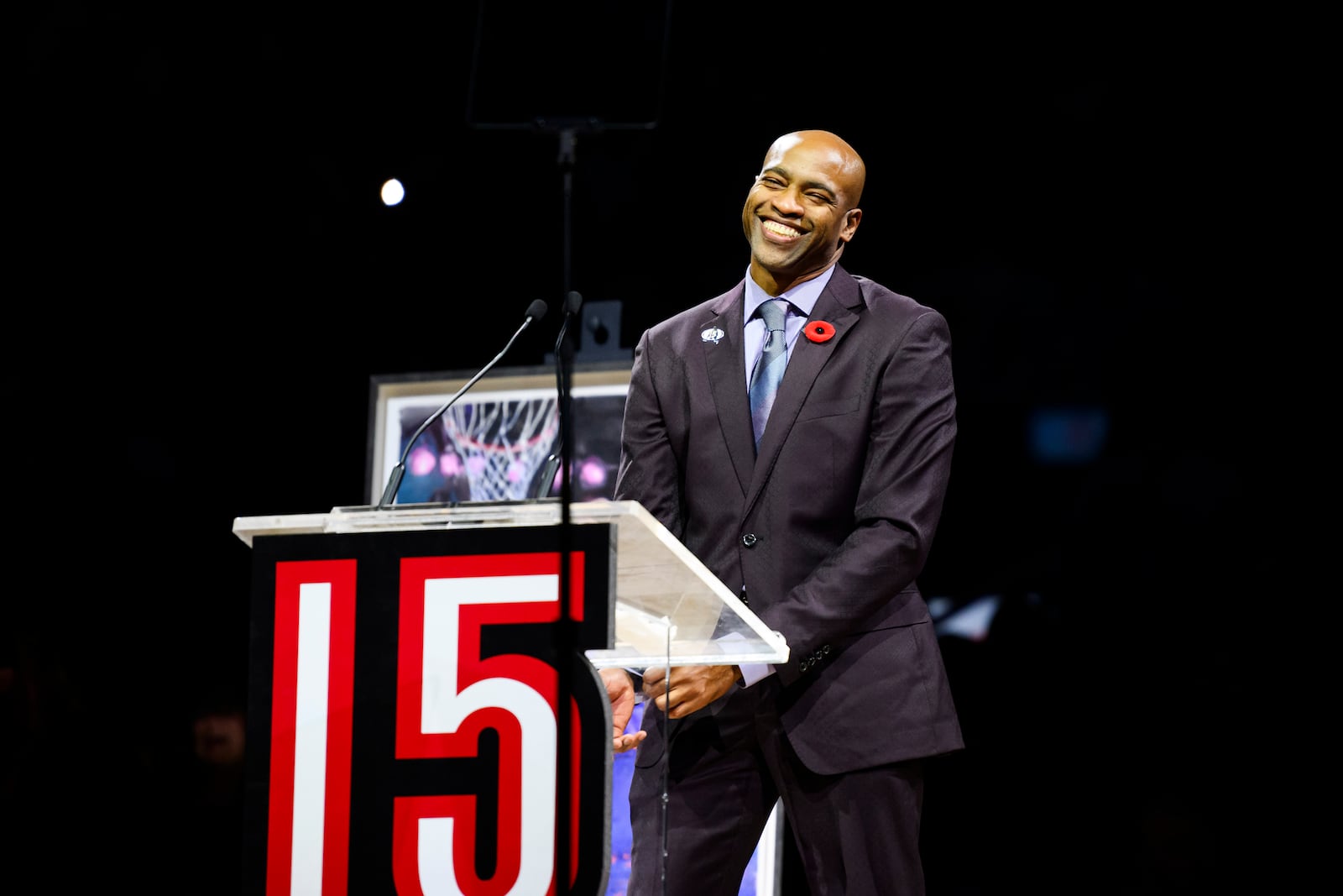 Former Toronto Raptors player Vince Carter reacts during his number retirement ceremony at halftime of an NBA basketball game between the Toronto Raptors and the Sacramento Kings in Toronto on Saturday, Nov. 2, 2024. (Christopher Katsarov/The Canadian Press via AP)