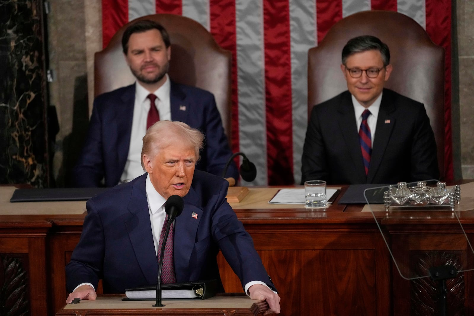 President Donald Trump talks about Greenland as he addresses a joint session of Congress in the House chamber at the U.S. Capitol in Washington, Tuesday, March 4, 2025, as Vice President JD Vance and House Speaker Mike Johnson of La., listen. (AP Photo/Julia Demaree Nikhinson)