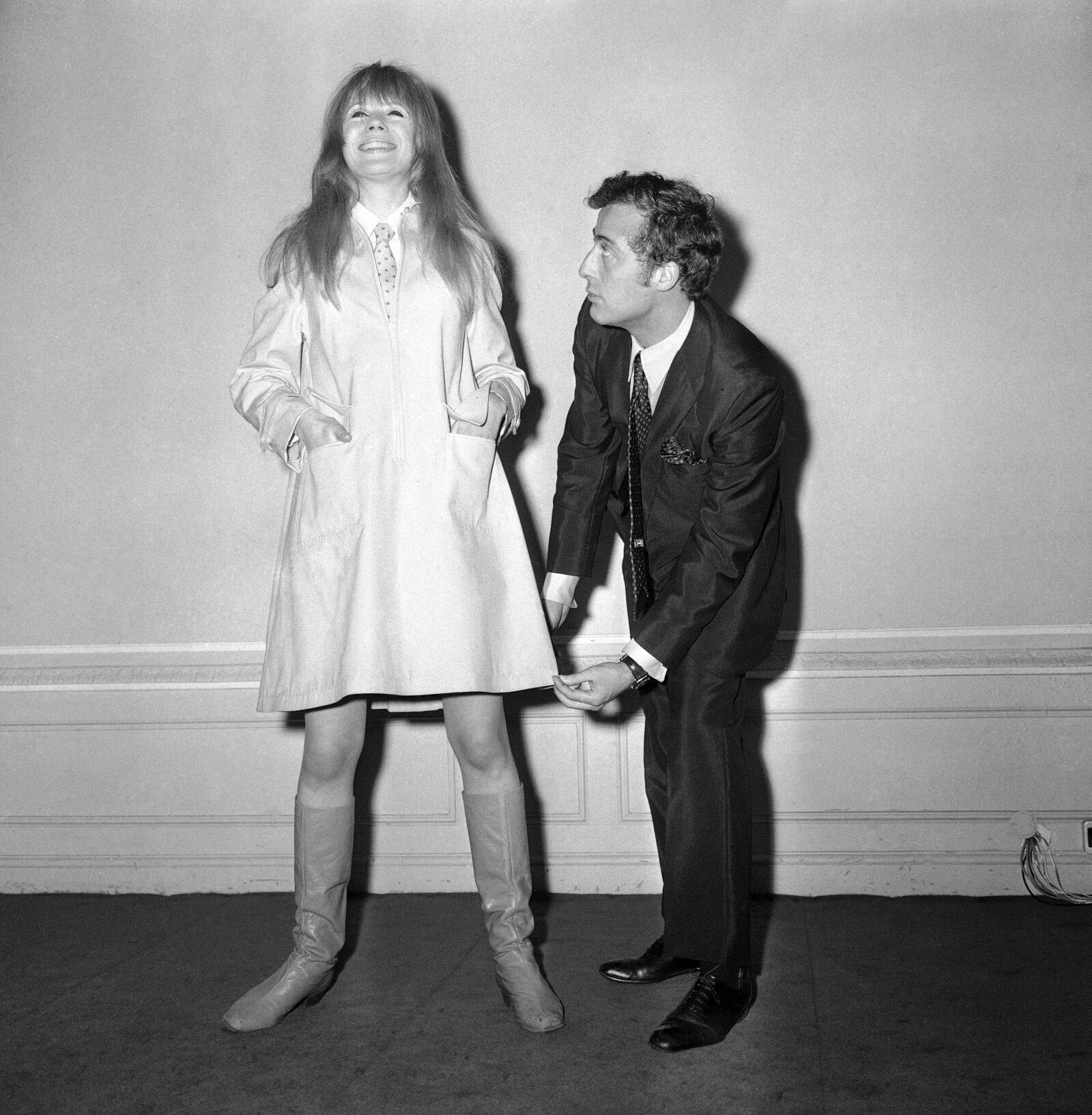 FILE - Daniel Hechter, 28-year-old French fashion designer, uses pop singer Marianne Faithfull as a model to display one of his latest creations, at the French Chamber of Commerce in London, England on Jan. 19, 1967. (AP Photo/Frank Leonard Tewkesbury, File)