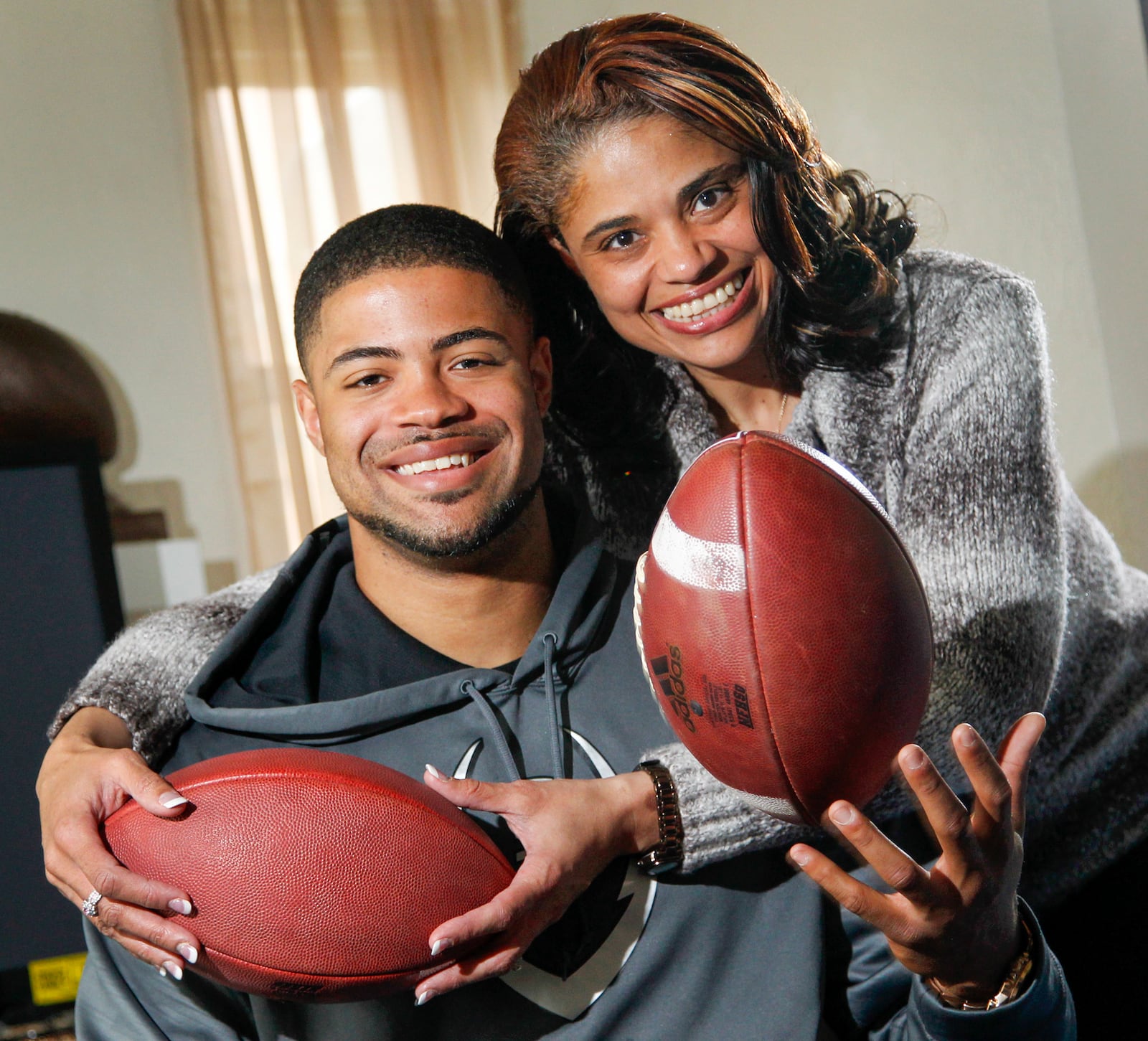 Cody Latimer and his mother Tonya Dunson at home in Dayton. Latimer will be an early draft pick in the NFL draft.   LISA POWELL / STAFF