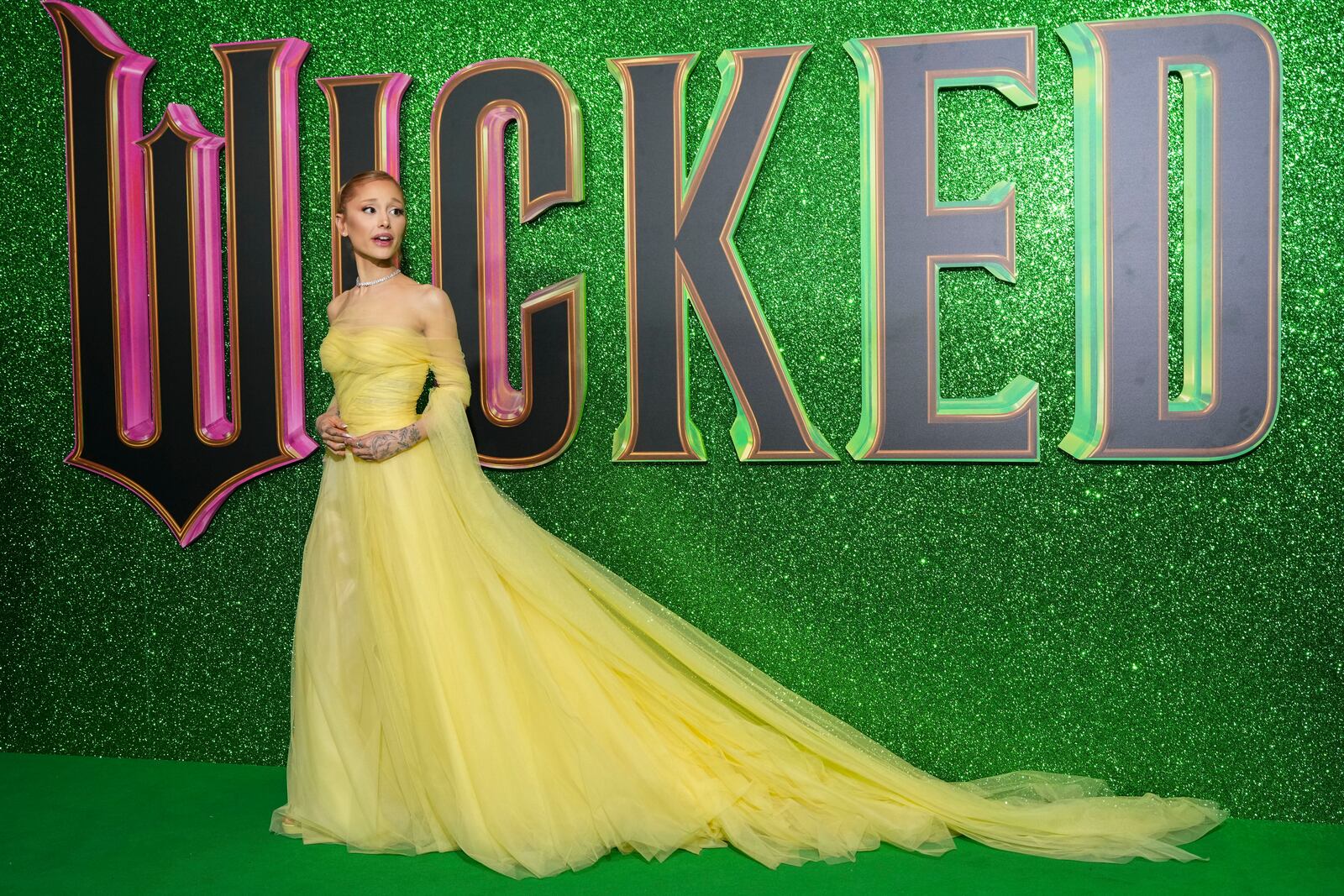 Ariana Grande poses for photographers upon arrival at the premiere of the film 'Wicked' on Monday, Nov. 18, 2024, in London. (Photo by Scott A Garfitt/Invision/AP)