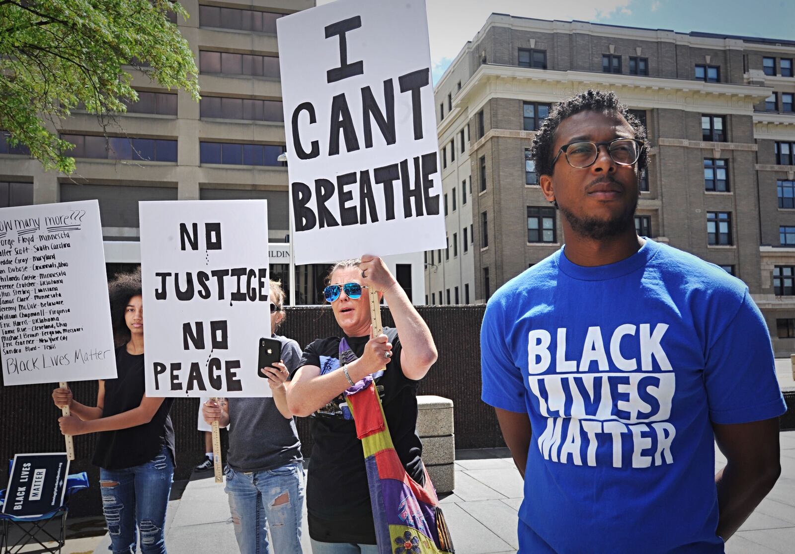 Hundreds gathered at the federal building in downtown Dayton on Saturday, May 30, 2020, to protest police violence. MARSHALL GORBY / STAFF