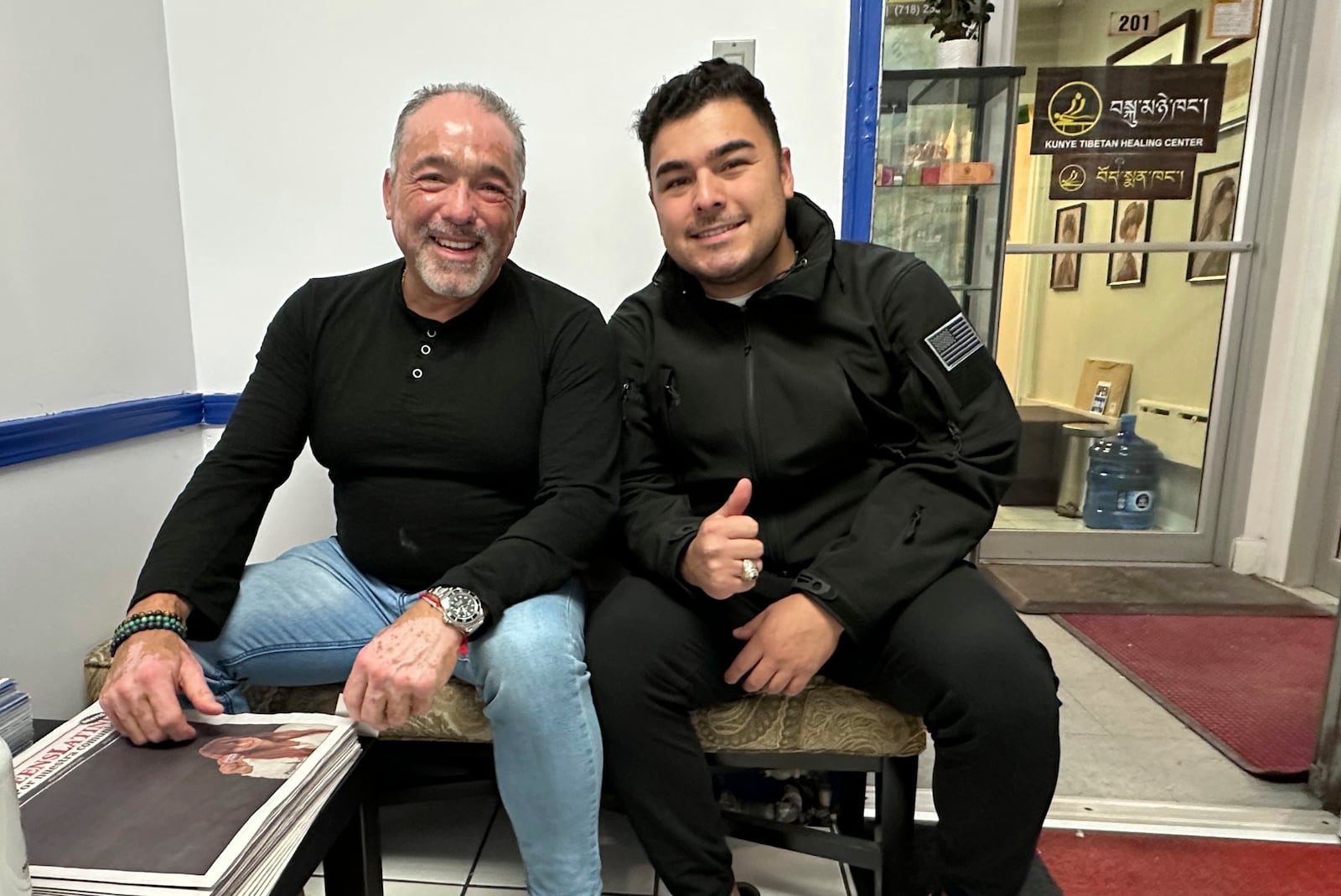 Eduardo Giraldo, left, and Sebastian Giraldo, voters in the part of the New York City borough of Queens that is represented by Rep. Alexandria Ocasio-Cortez, D-N.Y., pose for a photo on Nov. 12, 2024. The elder Giraldo, who owns an insurance business, voted for Vice President Kamala Harris, but his 24-year-old son, who is in the Air Force, voted for President-elect Donald Trump. (AP Photo/Philip Marcelo)