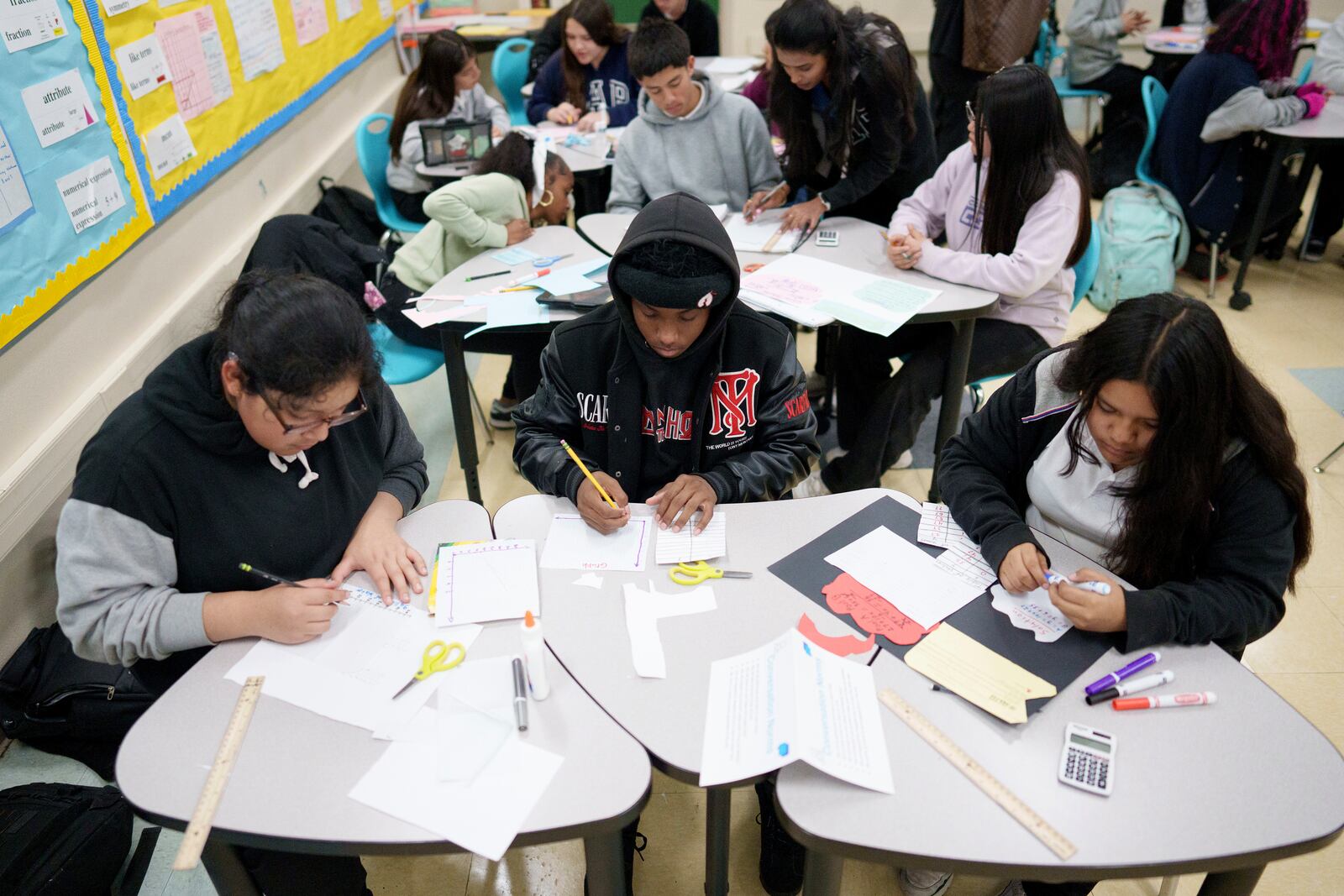 Students work in a classroom at Benjamin O. Davis Middle School in Compton, Calif., Thursday, Feb. 6, 2025. (AP Photo/Eric Thayer)