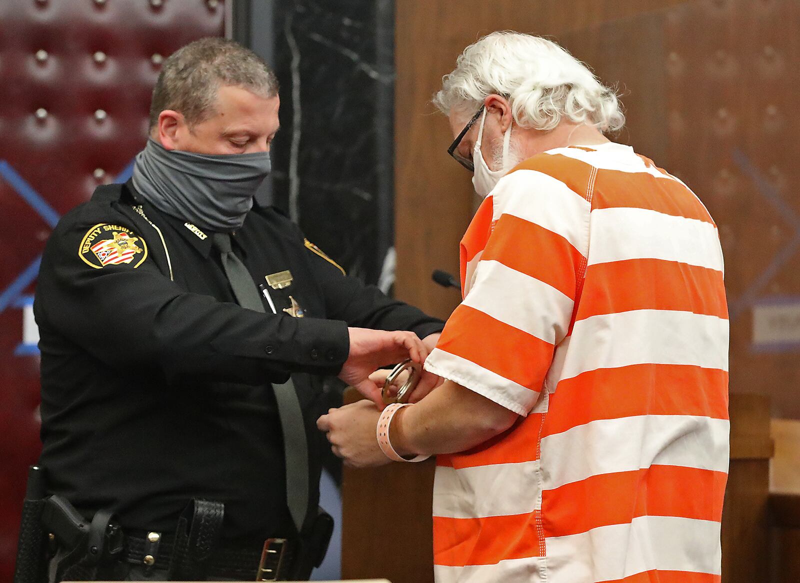 Rodney Rider is taken into custody by a Champaign County Deputy following his sentencing in Champaign County Common Pleas Court Monday. BILL LACKEY/STAFF