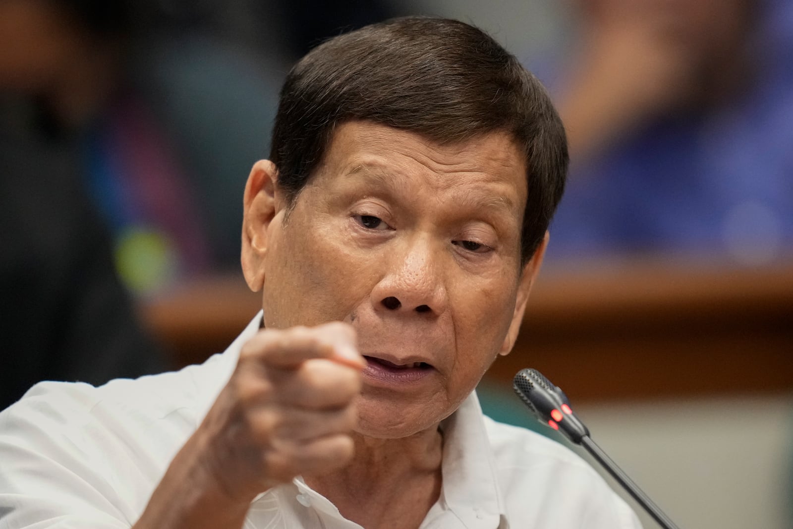 FILE - Former Philippine President Rodrigo Duterte speaks during a senate inquiry on the so-called war on drugs during his administration at the Philippine Senate Monday, Oct. 28, 2024, in Manila, Philippines. (AP Photo/Aaron Favila, File)