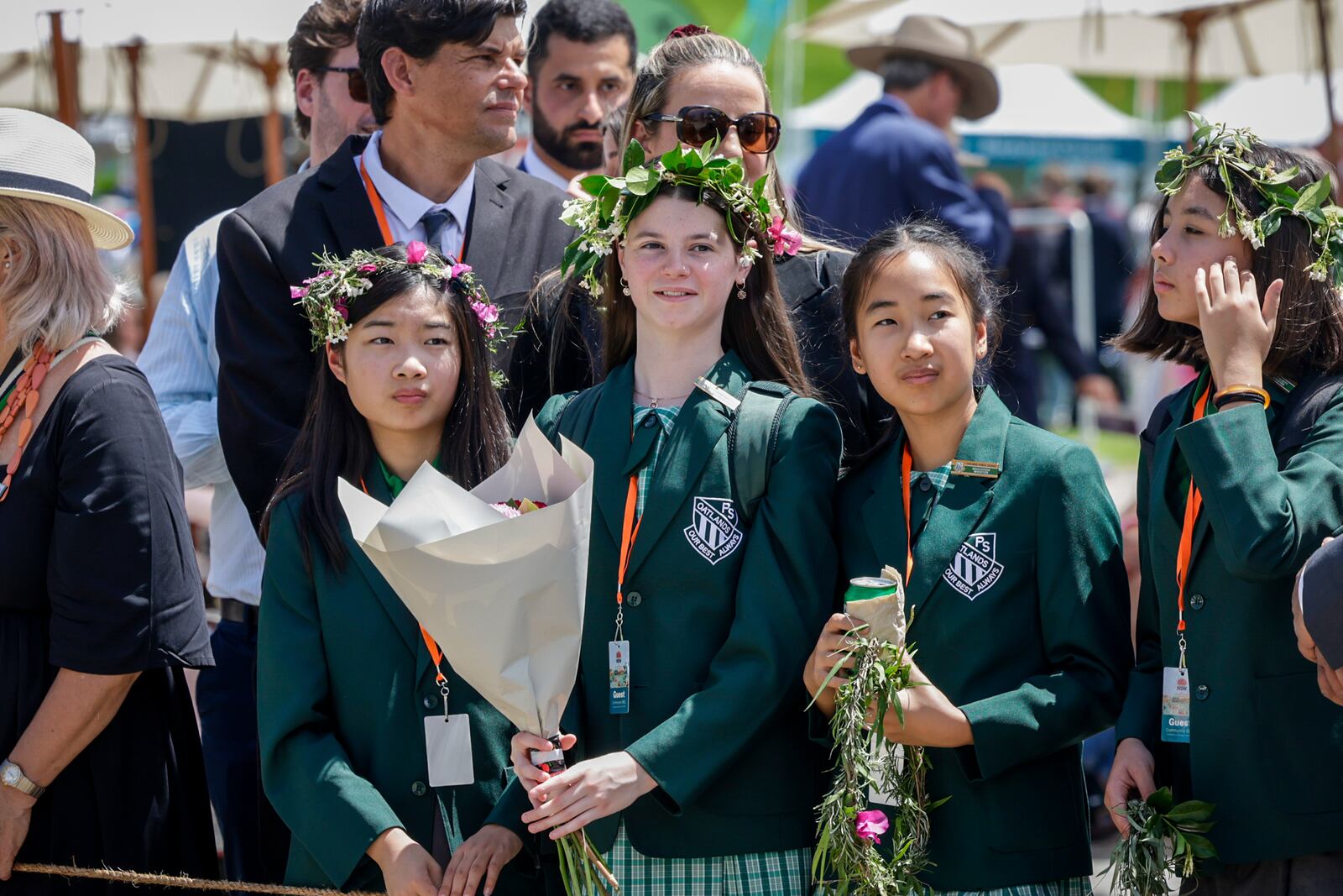 Members of the public wait for Britain's King Charles III and Queen Camilla to arrive to attend the Premier's Community BBQ on Tuesday Oct. 22, 2024 in Sydney, Australia. (Brook Mitchell/Pool Photo via AP)