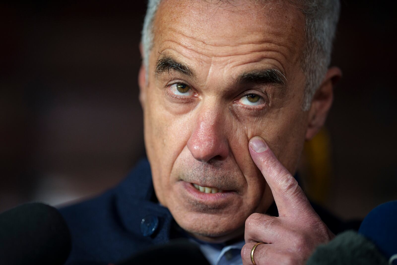 FILE - Calin Georgescu, running as an independent candidate for president touches his face while speaking to media, in Izvorani, Romania, Tuesday, Nov. 26, 2024, after making it to the Dec. 8 election runoff. (AP Photo/Vadim Ghirda, File)