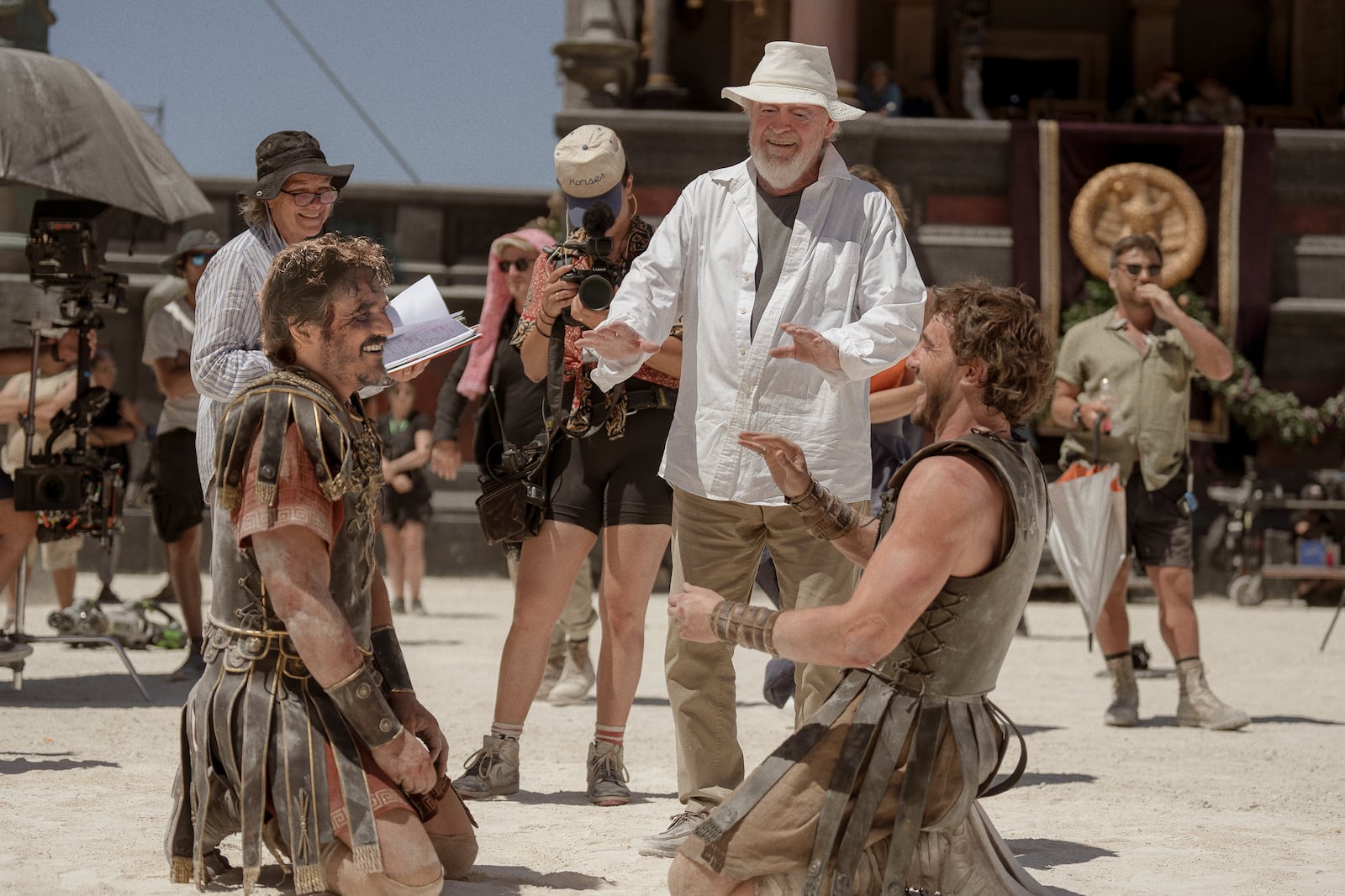 This image released by Paramount Pictures shows Pedro Pascal, from left, director Ridley Scott, and Paul Mescal on the set of "Gladiator II." (Aidan Monaghan/Paramount Pictures via AP)