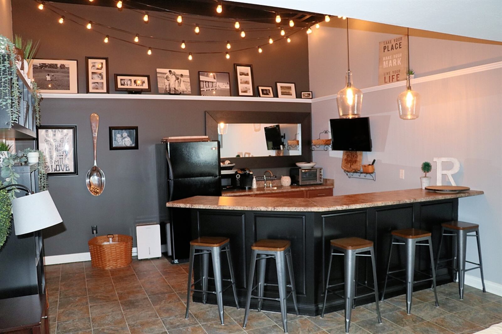 In the kitchenette area, an angled peninsula counter offers bar seating for six and has a sink and space for large appliances.