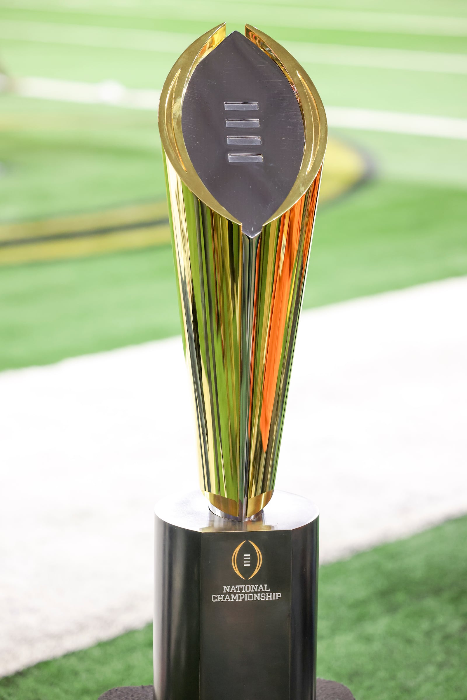 The College Football Playoff National Championship Trophy is shown before the Cotton Bowl College Football Playoff semifinal game between Texas and Ohio State, Jan. 10, 2025, in Arlington, Texas. (AP Photo/Gareth Patterson)