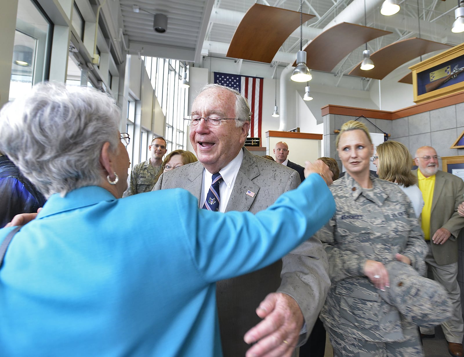 Former U.S. Rep. Dave Hobson is congratulated by friends during a dedication ceremony for the new Hobson Cyberspace Communications Complex Wednesday at the Springfield Air National Guard Base. Bill Lackey/Staff