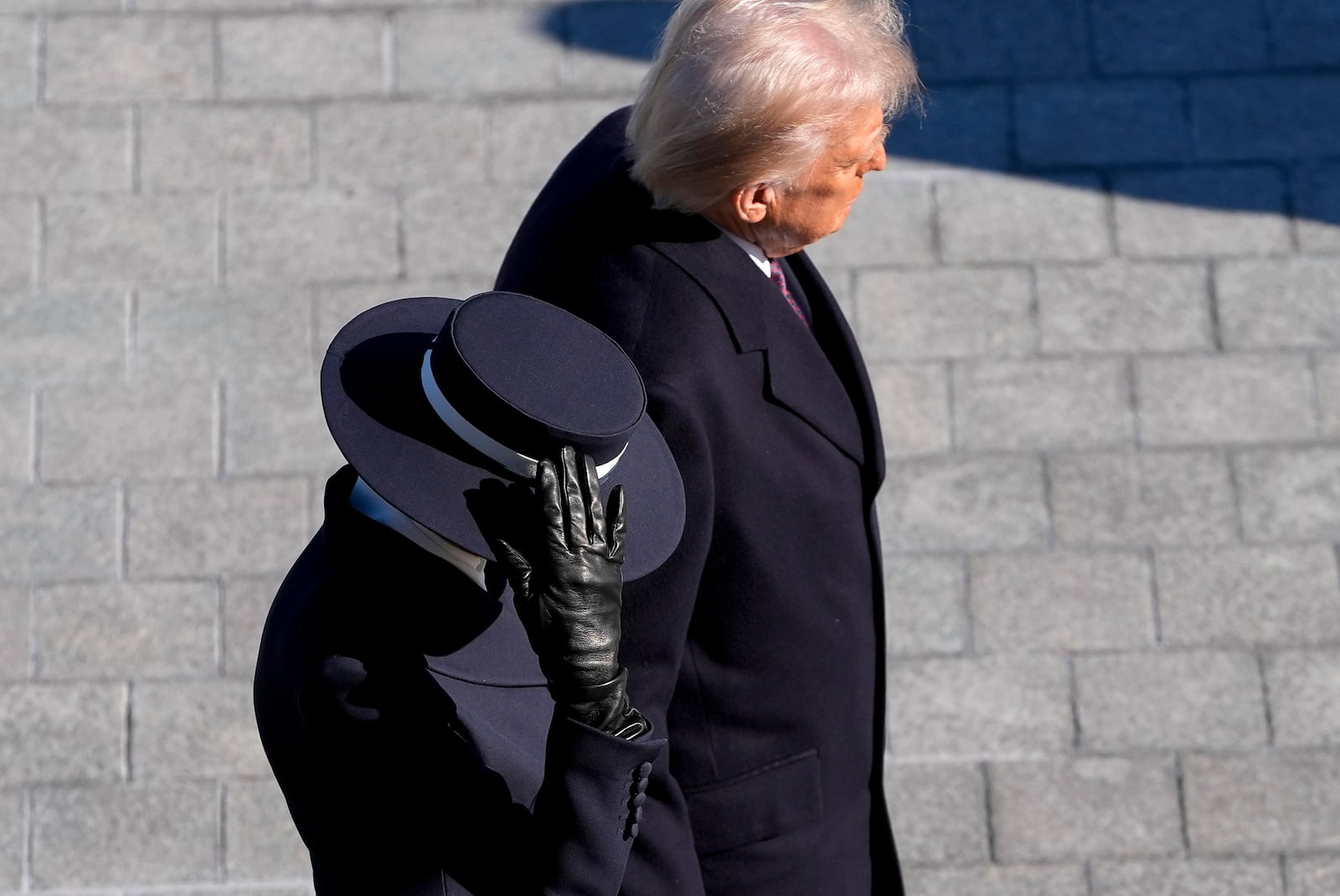 First lady Melania Trump, left, and President Donald Trump walk to send off former President Joe Biden and Jill Biden after the 60th Presidential Inauguration, Monday, Jan. 20, 2025, at the U.S. Capitol in Washington. (Jack Gruber/Pool Photo via AP)