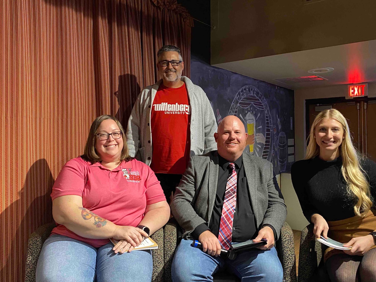 Wittenberg University's Tiger Tank panel of judges this year included Kristen Bailey, Wittenberg class of 2002, who is the CEO of Sweets and Meats BBQ and a current board member of America's Small Business Development Center; Rob Alexander, executive director of the Small Business Development Center in Springfield; and Melanie Barrett, Wittenberg class of 2021 and past Tiger Tank winner, who is the CEO of Bailey's Capes. Kevin Steidel, professor of practice, business, economics, and entrepreneurship, who hosted the event, is standing behind them. Contributed/Wittenberg University