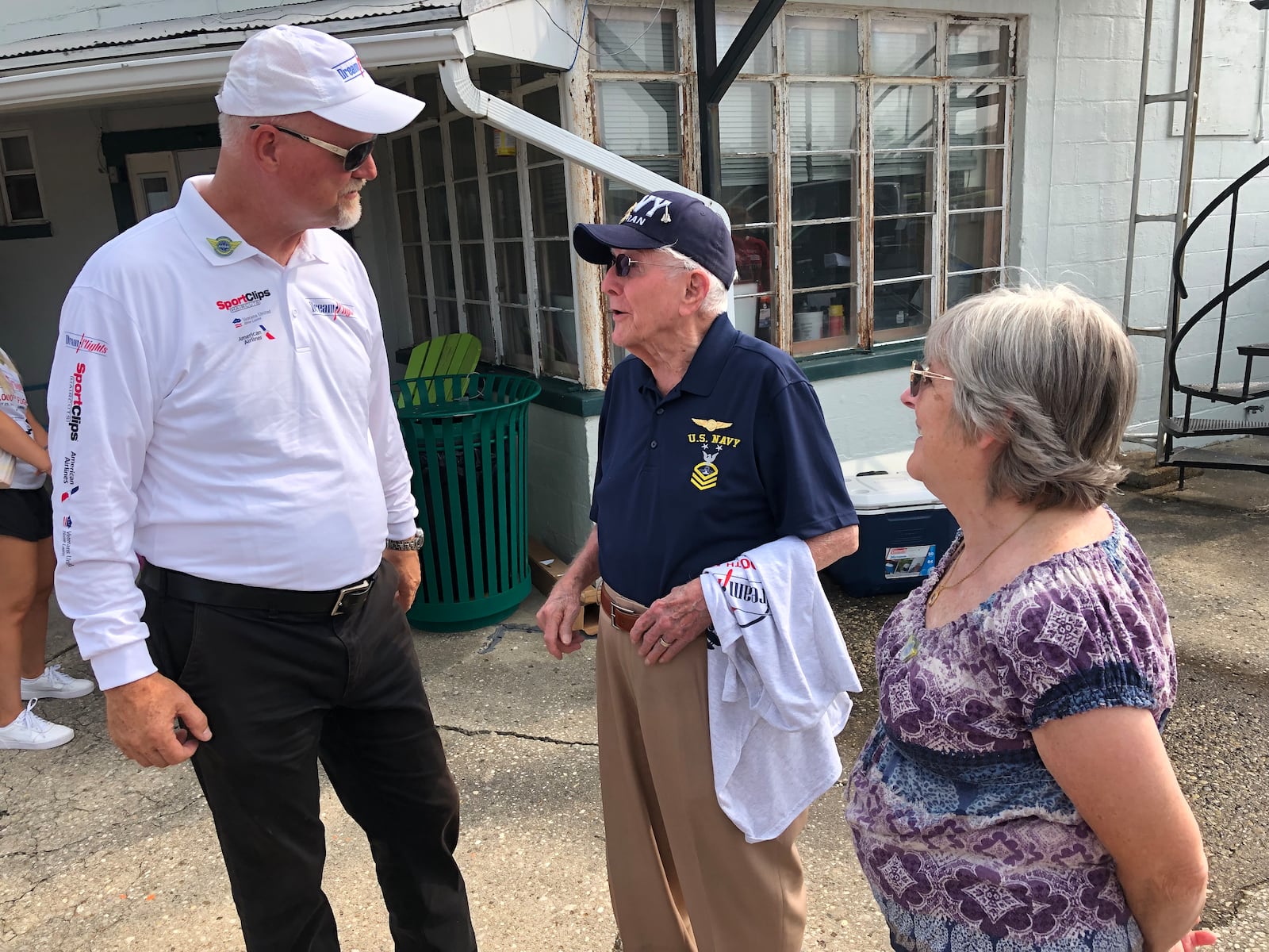 Dream Flights founder Darryl Fisher, left, meets with Don Muncy prior to his going on the landmark 6,000th flight given to honor veterans by the nonprofit organization. Muncy, age 100, served in the U.S. Navy in World War II and the Korean War and was accompanied by his daughter, Diana Glasgow, who was celebrating her birthday on Tuesday.