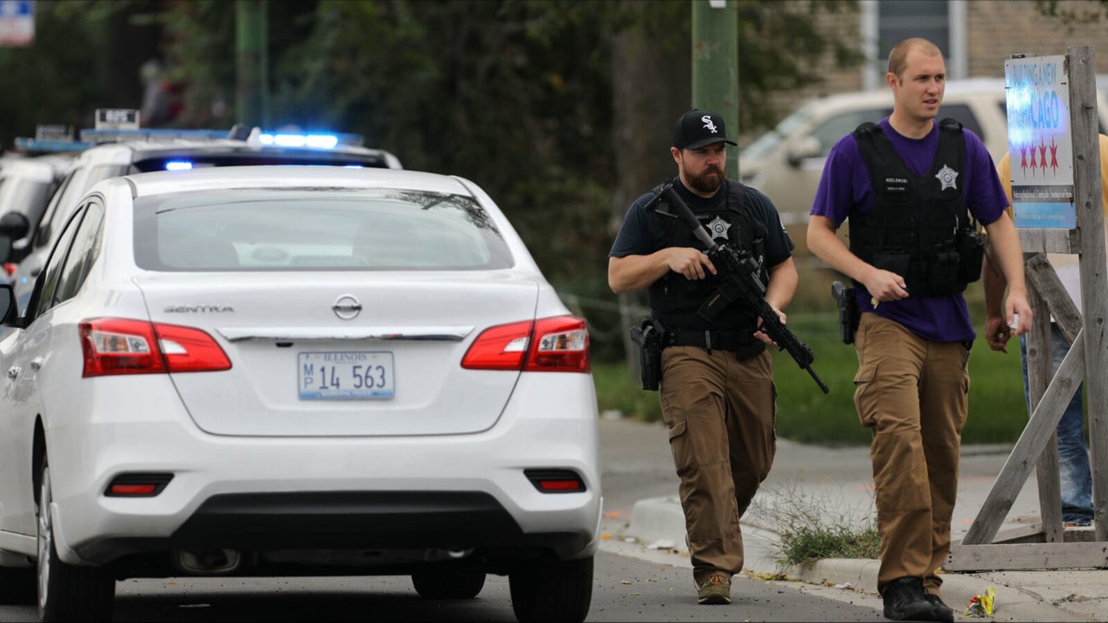 Chicago police officers search for suspected gunman Michael Blackman, 45, on Saturday, Sept. 21, 2019, after a fellow officer was shot. The gunfire took place as officers tried to arrest Blackman, 45, in the shooting of a woman three days earlier.