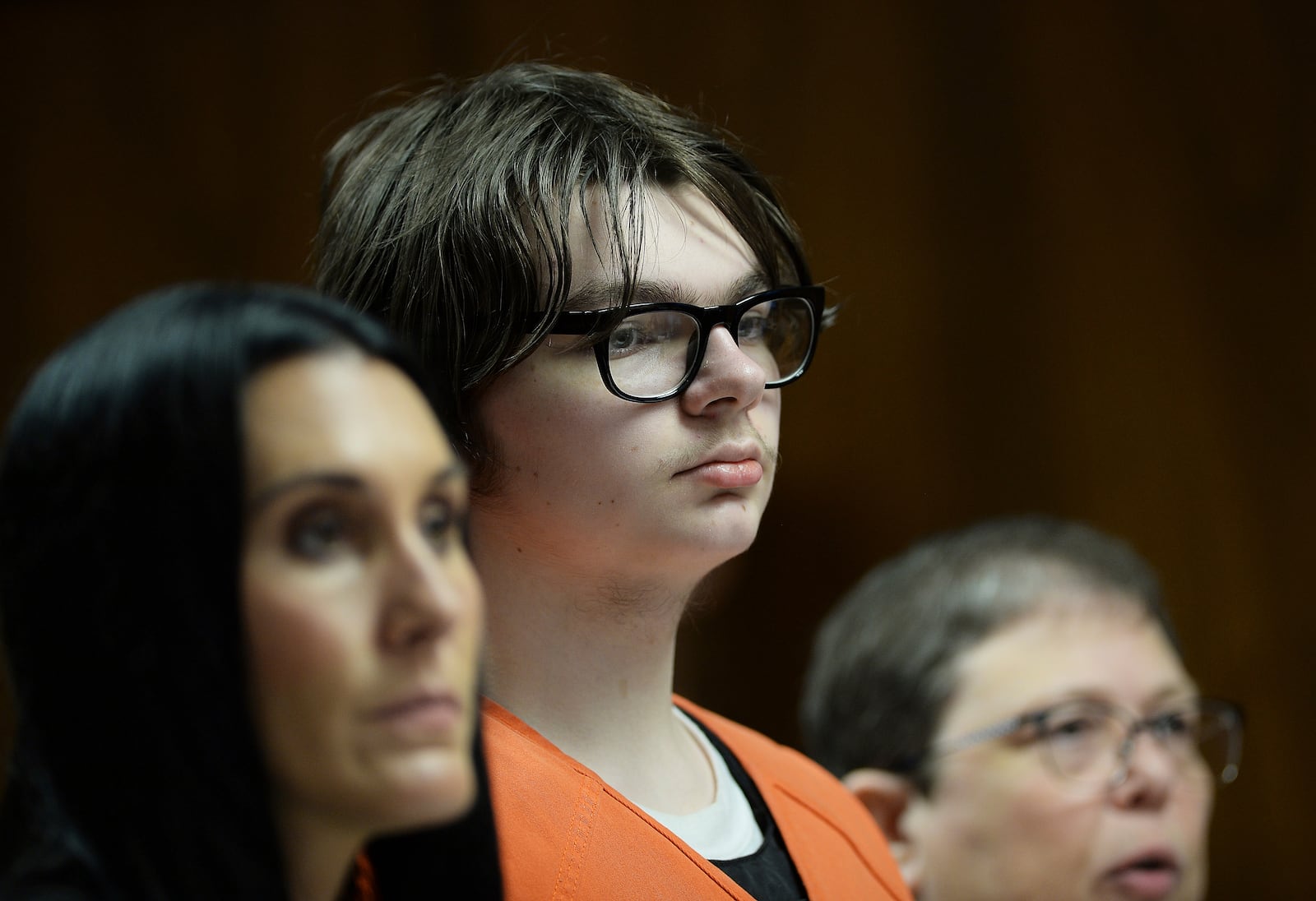 FILE - Ethan Crumbley stands with his attorneys, Paulette Loftin and Amy Hopp, during his hearing at Oakland County Circuit Court, Aug. 1, 2023, in Pontiac, Mich. (Clarence Tabb Jr./Detroit News via AP, Pool)