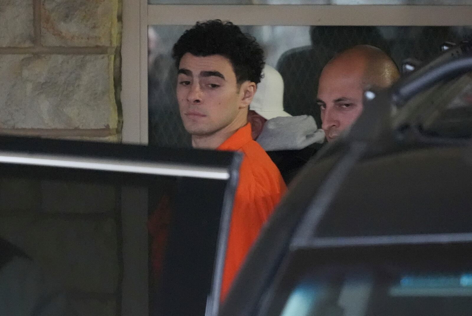 Luigi Nicholas Mangione leaves at Blair County Courthouse in Hollidaysburg, Pa., Thursday, Dec. 19, 2024. (AP Photo/Gene J. Puskar, Pool)