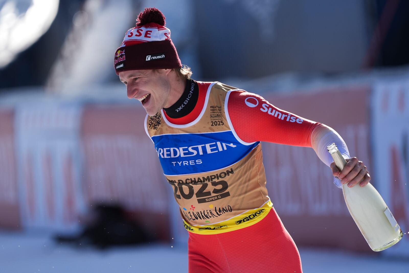 Switzerland's Marco Odermatt celebrates after winning the gold medal in a men's Super-G, at the Alpine Ski World Championships, in Saalbach-Hinterglemm, Austria, Friday, Feb. 7, 2025. (AP Photo/Giovanni Auletta)