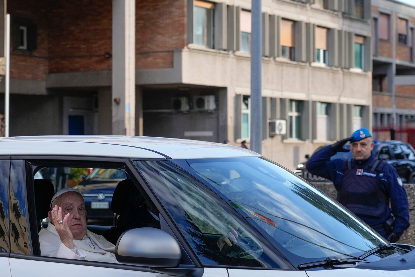 Pope Francis leaves the Rebibbia Prison where he symbolically opened a Holy Door with inmates in Rome, Thursday, Dec. 26, 2024. (AP Photo/Gregorio Borgia)