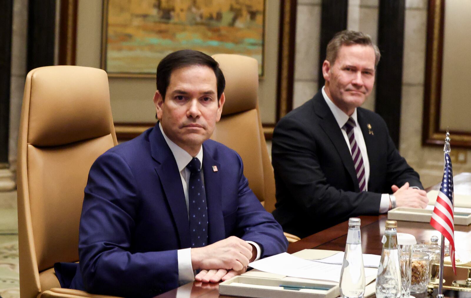 U.S. Secretary of State Marco Rubio, center, sits next to U.S. National Security Advisor Mike Waltz during a meeting with Saudi Foreign Minister Prince Faisal bin Farhan Al Saud, Saudi National Security Advisor Mosaad bin Mohammad Al-Aiban, Russian Foreign Minister Sergei Lavrov and Russian President Vladimir Putin's foreign policy advisor Yuri Ushakov, at Diriyah Palace, in Riyadh, Saudi Arabia, Tuesday, Feb. 18, 2025. (Evelyn Hockstein/Pool Photo via AP)