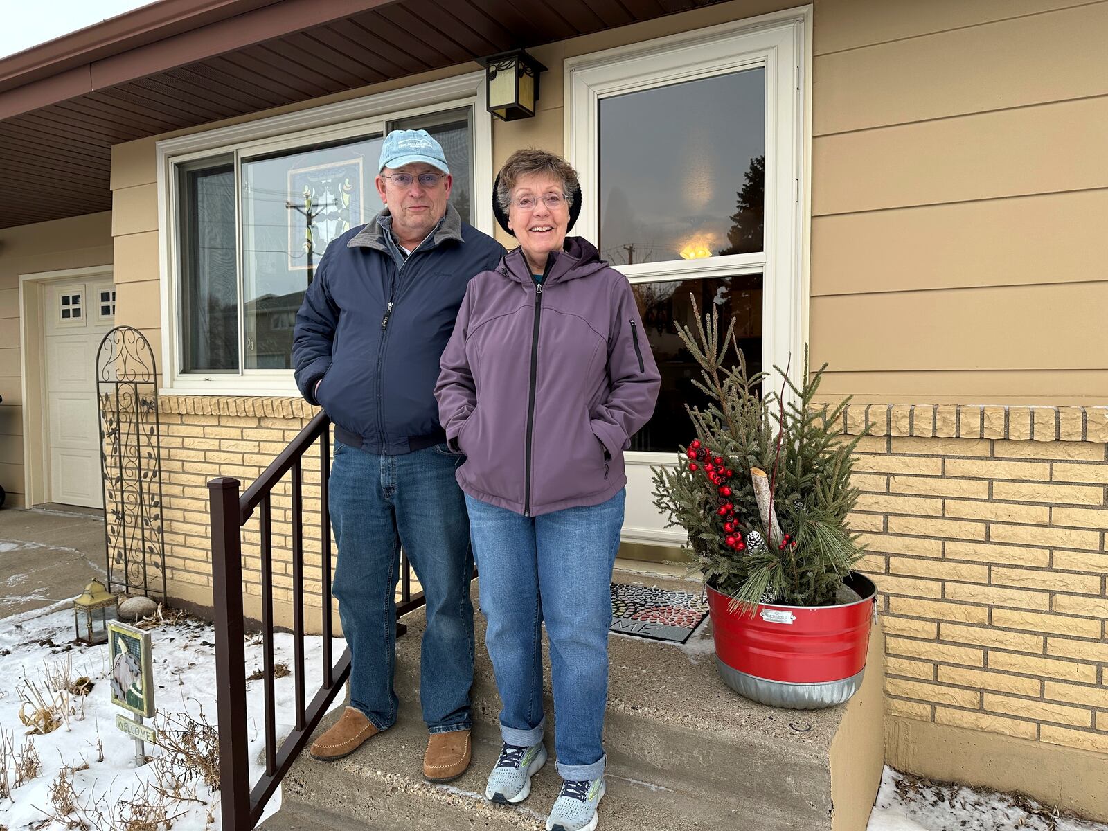 Pat and Julie O'Dell stand outside their home in Bismarck, N.D., on Friday, Jan. 10, 2025. (AP Photo/Jack Dura)