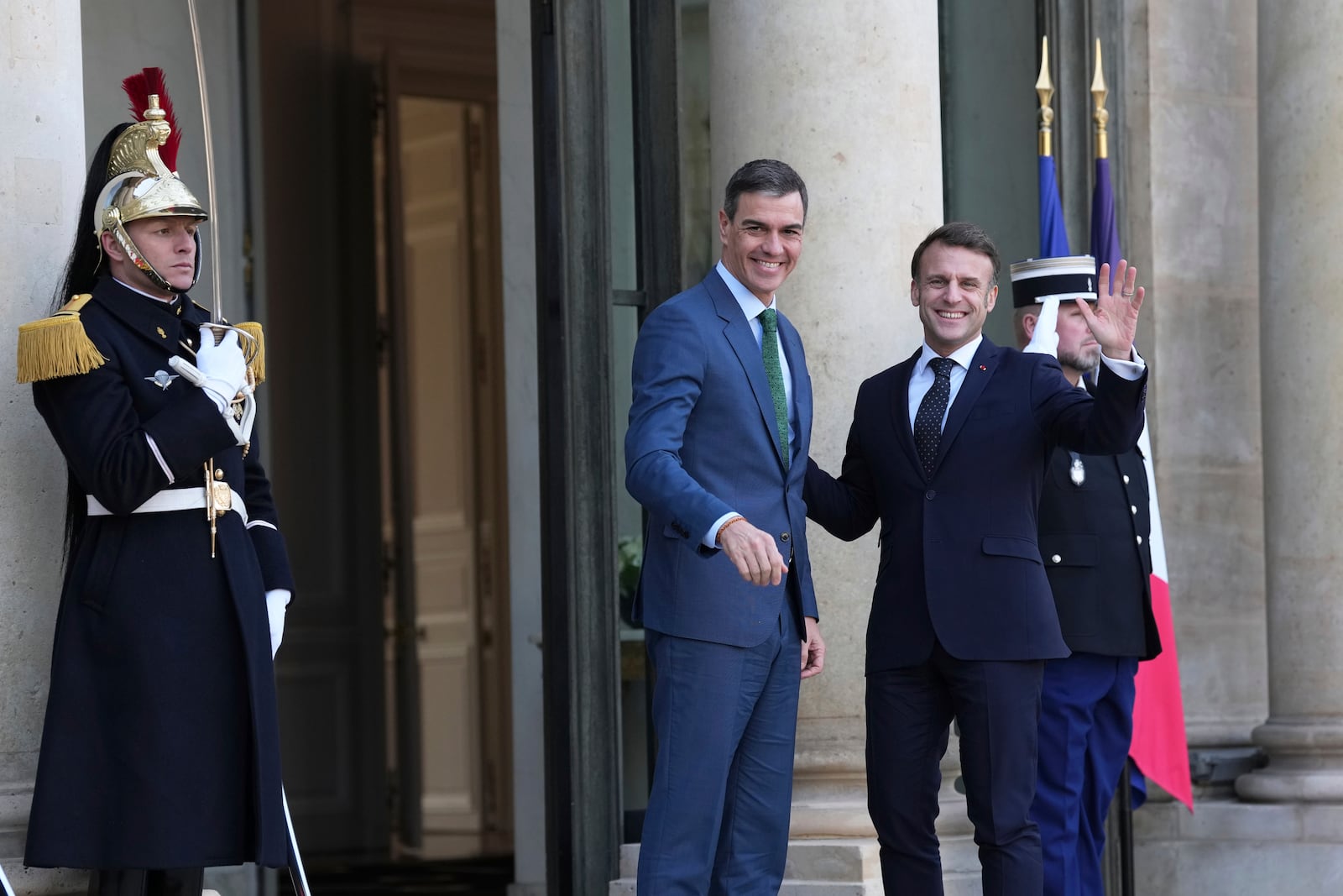 French President Emmanuel Macron, right, greets Spain's Prime Minister Pedro Sanchez as he arrives for an informal meeting of leaders from key European Union nations and the United Kingdom at the Elysee Palace in Paris, Monday, Feb. 17, 2025. (AP Photo/Aurelien Morissard)